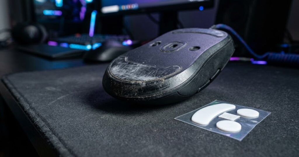 Worn mouse skates on gaming mouse showing when to replace skates