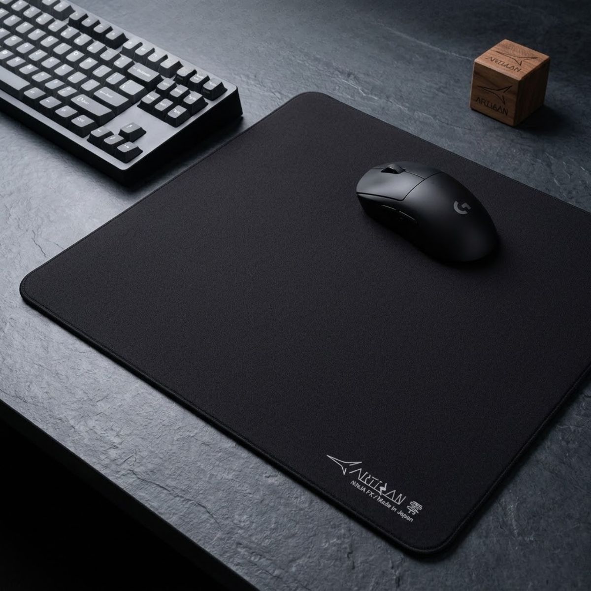 Artisan Zero gaming mouse pad lying flat on a desk with a gaming mouse placed on top for competitive FPS gaming.