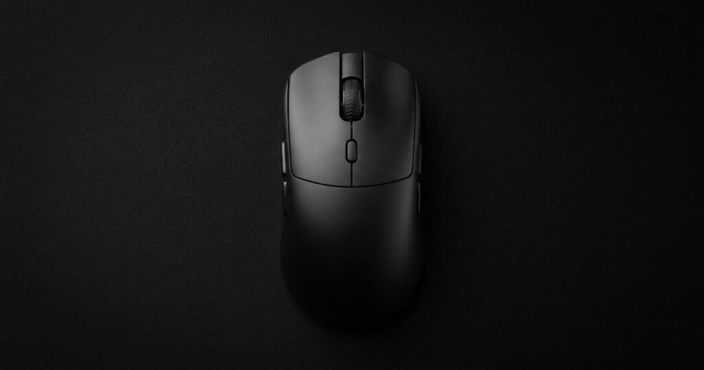 A symmetrical gaming mouse displayed from a top-down angle showing equal left and right side contours