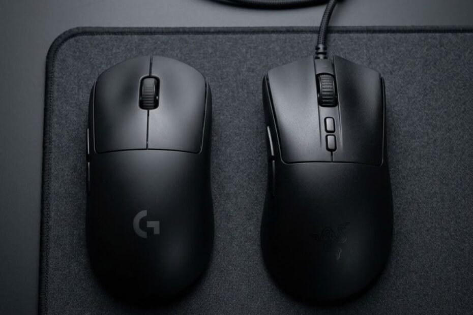 A symmetrical and an ergonomic gaming mouse side-by-side on a desk, representing shape options for FPS gaming.