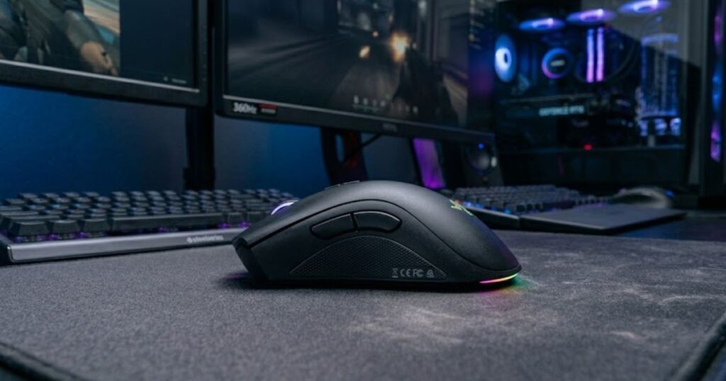 An ergonomic gaming mouse viewed from an angled side perspective showing thumb support, palm support, and curved shell contours.