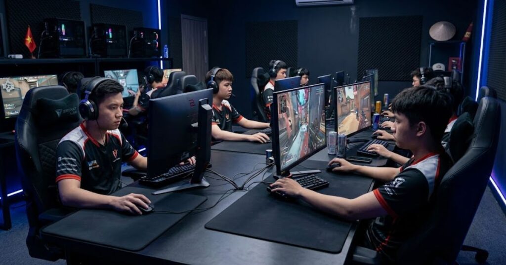 Several FPS players using large gaming mouse pads during competitive gaming sessions.