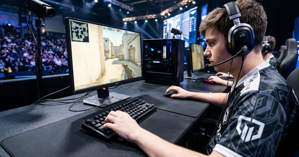A professional FPS gaming setup featuring an angled keyboard, gaming mouse, and large mouse pad.