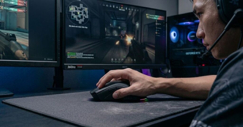 A Valorant player using an ergonomic gaming mouse with full palm contact while holding a precise angle during gameplay.