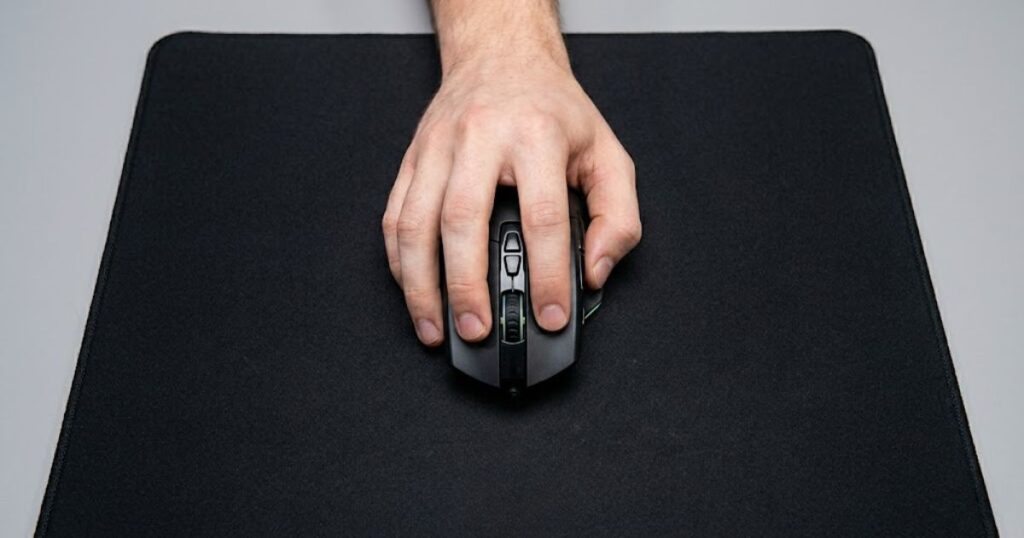 Top-down view of a hand correctly positioned on a gaming mouse using claw grip