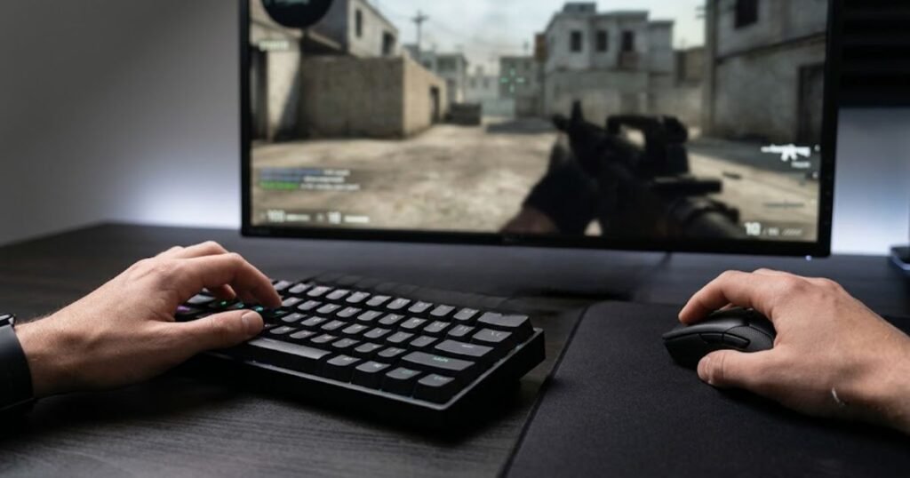 FPS player using the WASD keys on a gaming keyboard while controlling a mouse